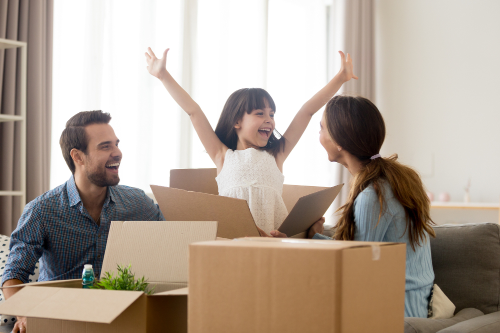Happy,Kid,Daughter,Jumping,Out,Of,Box,Excited,About,Moving